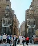 Temple of Luxor - colossal statues Ramses II at the Pylon