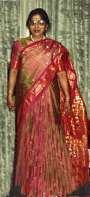 Savita wearing a festive handmade Sari from pure slik